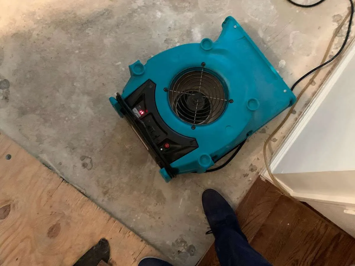 Air mover drying subfloor during Leak Detection & Repair in Ephrata